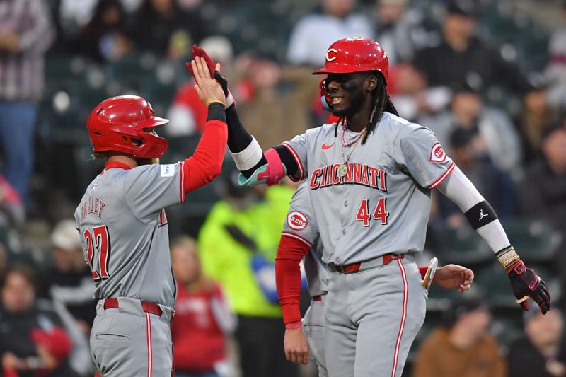 Apr 12, 2024; Chicago, Illinois, USA; Cincinnati Reds shortstop Elly De La Cruz (44) celebrates his three-run home run with right fielder Jake Fraley (27) during the third inning against Chicago White Sox at Guaranteed Rate Field. Mandatory Credit: Patrick Gorski-USA TODAY Sports