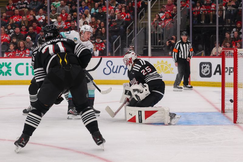 Jan 14, 2026; Newark, New Jersey, USA; Seattle Kraken defenseman Adam Larsson (6) (not pictured) scores a goal on New Jersey Devils goaltender Jacob Markstrom (25) during the first period at Prudential Center. Mandatory Credit: Ed Mulholland-Imagn Images