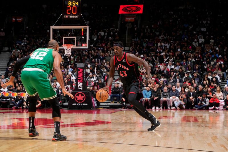 TORONTO, CANADA - JANUARY 15: Pascal Siakam #43 of the Toronto Raptors handles the ball during the game against the Boston Celtics  on January 15, 2024 at the Scotiabank Arena in Toronto, Ontario, Canada.  NOTE TO USER: User expressly acknowledges and agrees that, by downloading and or using this Photograph, user is consenting to the terms and conditions of the Getty Images License Agreement.  Mandatory Copyright Notice: Copyright 2024 NBAE (Photo by Mark Blinch/NBAE via Getty Images)