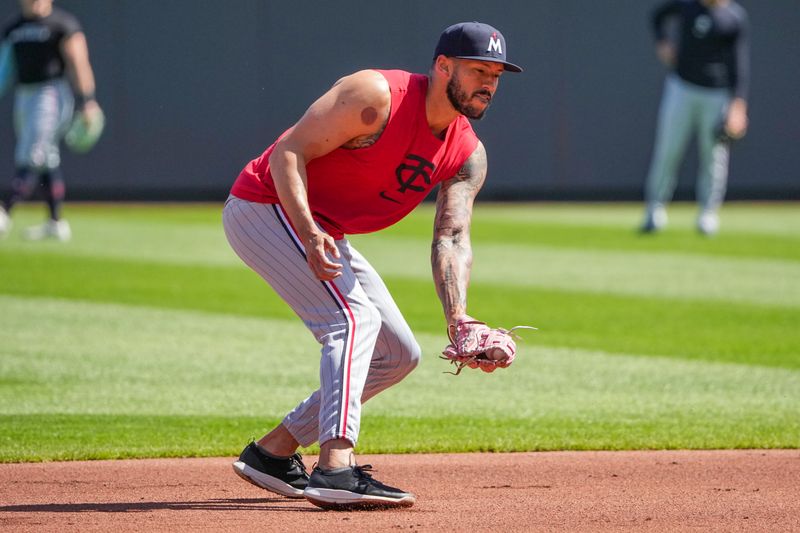 Apr 10, 2025; Kansas City, Missouri, USA; Minnesota Twins shortstop Carlos Correa (4) warms up against the Kansas City Royals prior to a game at Kauffman Stadium. Mandatory Credit: Denny Medley-Imagn Images