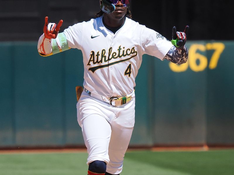 Jul 4, 2024; Oakland, California, USA; Oakland Athletics right fielder Lawrence Butler (4) gestures as he rounds the bases on a solo home run against the Los Angeles Angels during the eighth inning at Oakland-Alameda County Coliseum. Mandatory Credit: Kelley L Cox-USA TODAY Sports