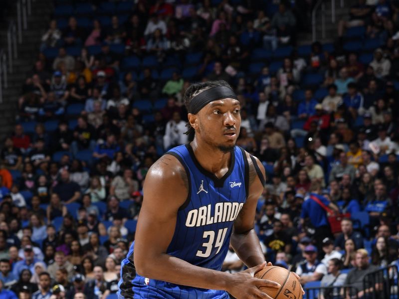 ORLANDO, FL - FEBRUARY 29: Wendell Carter Jr. #34 of the Orlando Magic handles the ball during the game against the Utah Jazz on February 29, 2024 at Amway Center in Orlando, Florida. NOTE TO USER: User expressly acknowledges and agrees that, by downloading and or using this photograph, User is consenting to the terms and conditions of the Getty Images License Agreement. Mandatory Copyright Notice: Copyright 2024 NBAE (Photo by Fernando Medina/NBAE via Getty Images)