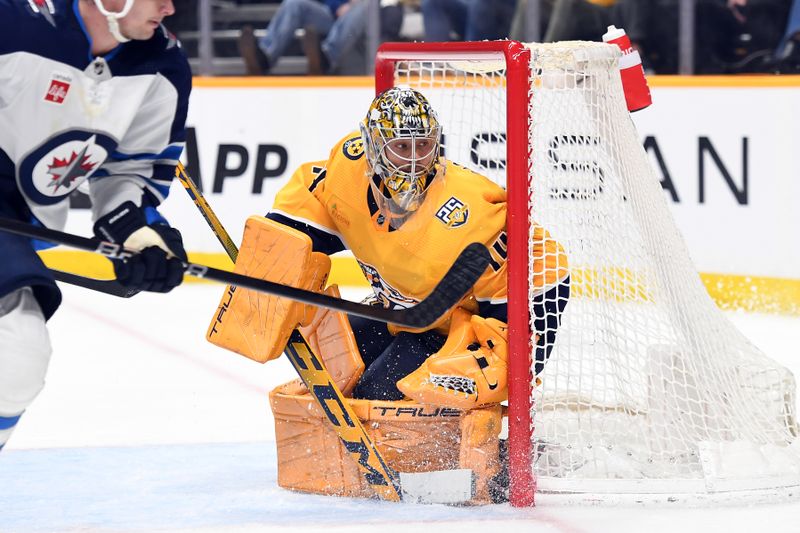 Apr 9, 2024; Nashville, Tennessee, USA; Nashville Predators goaltender Juuse Saros (74) watches the puck in the corner during the second period against the Winnipeg Jets at Bridgestone Arena. Mandatory Credit: Christopher Hanewinckel-USA TODAY Sports