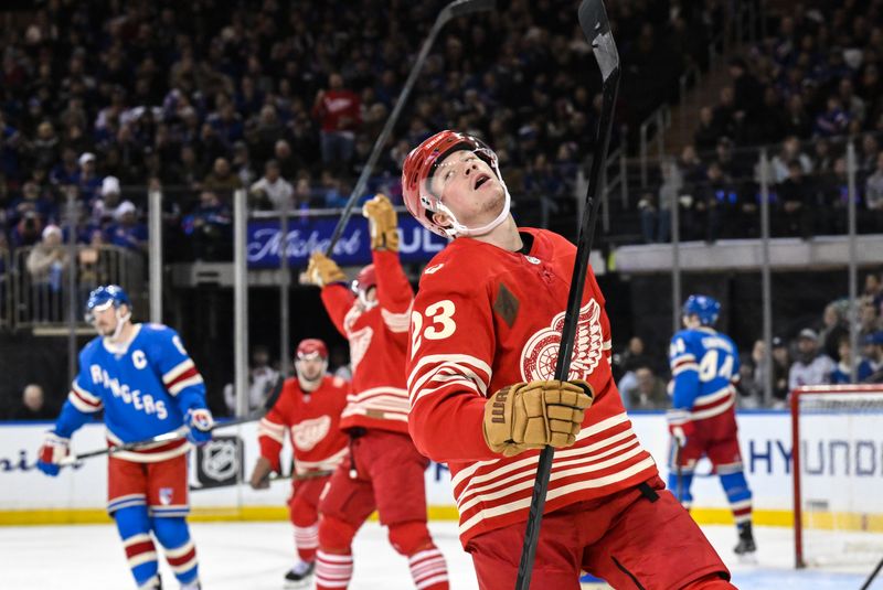 Nov 16, 2025; New York, New York, USA; Detroit Red Wings left wing Lucas Raymond (23) reacts after an assist of a goal by Detroit Red Wings right wing Alex Debrincat (93) during the second period against the New York Rangers at Madison Square Garden. Mandatory Credit: John Jones-Imagn Images