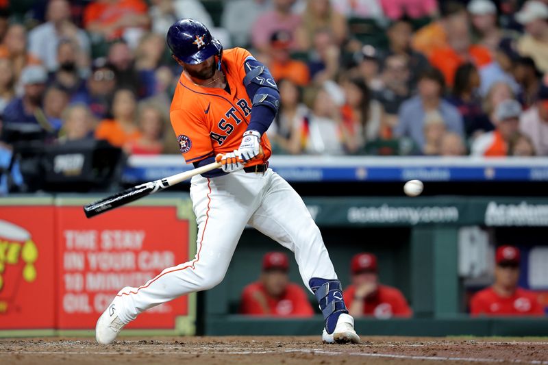May 9, 2025; Houston, Texas, USA; Houston Astros first baseman Christian Walker (8) hits a single against the Cincinnati Reds during the fourth inning at Daikin Park. Mandatory Credit: Erik Williams-Imagn Images