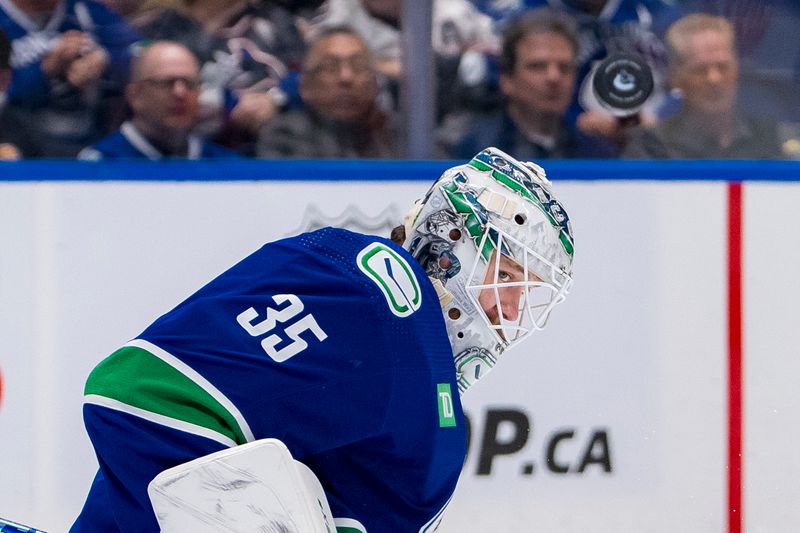 Apr 16, 2024; Vancouver, British Columbia, CAN;  Vancouver Canucks goalie Thatcher Demko (35) makes a save against the Calgary Flames in the second period at Rogers Arena. Mandatory Credit: Bob Frid-USA TODAY Sports