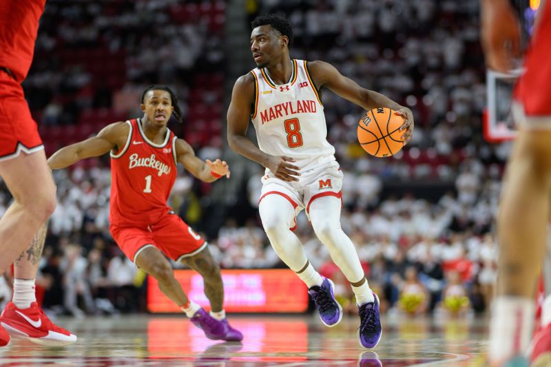 Dec 4, 2024; College Park, Maryland, USA; Maryland Terrapins guard Jay Young (8) handles the ball during the second half against the Ohio State Buckeyes at Xfinity Center. Mandatory Credit: Reggie Hildred-Imagn Images