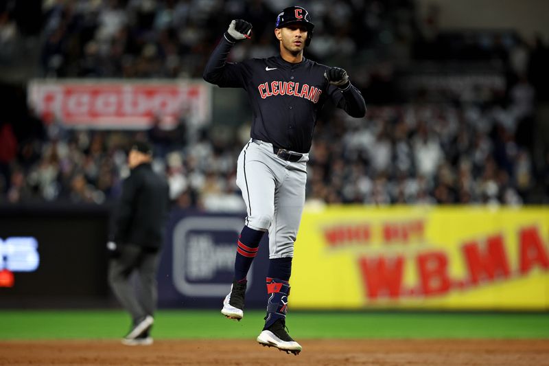 Oct 14, 2024; Bronx, New York, USA; Cleveland Guardians shortstop Brayan Rocchio (4) celebrates after hitting a solo home run during the sixth inning against the New York Yankees in game one of the ALCS for the 2024 MLB Playoffs at Yankee Stadium. Mandatory Credit: Wendell Cruz-Imagn Images