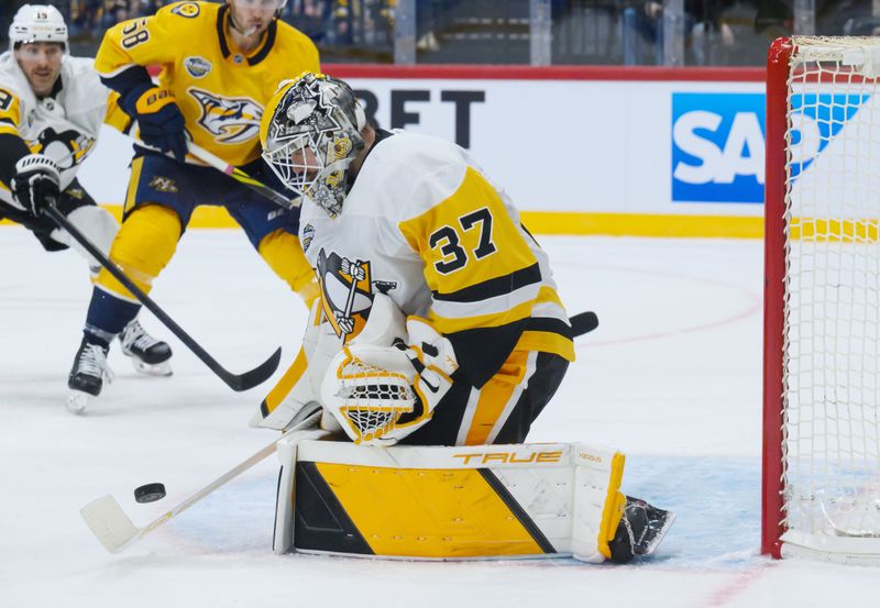 Nov 14, 2025; Stockholm, SWEDEN; Pittsburgh Penguins goaltender Arturs Silovs (37) makes a save against the Nashville Predators in a Global Series ice hockey game at Avicii Arena. Mandatory Credit: Per Haljestam-Imagn Images