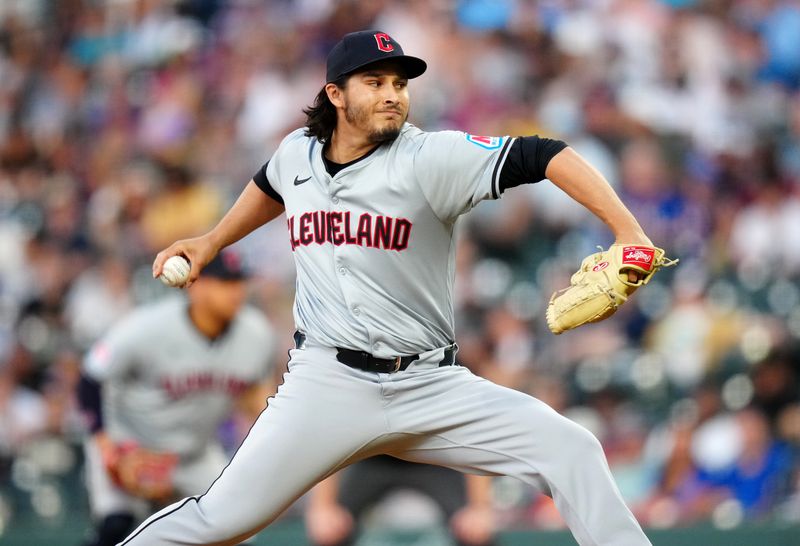 May 29, 2024; Denver, Colorado, USA; Cleveland Guardians relief pitcher Eli Morgan (49) delivers a pitch in fifth inning against the Colorado Rockies at Coors Field. Mandatory Credit: Ron Chenoy-USA TODAY Sports