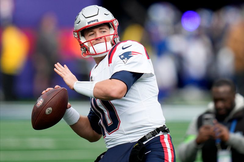 New England Patriots quarterback Mac Jones (10) warms up before playing against the New York Giants in an NFL football game, Sunday, Nov. 26, 2023, in East Rutherford, N.J. (AP Photo/Seth Wenig)