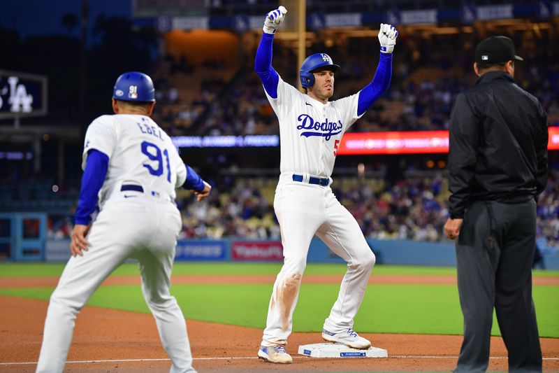 May 4, 2024; Los Angeles, California, USA; Los Angeles Dodgers first baseman Freddie Freeman (5) reacts after hitting a triple against the Atlanta Braves during the sixth inning at Dodger Stadium. Mandatory Credit: Gary A. Vasquez-USA TODAY Sports