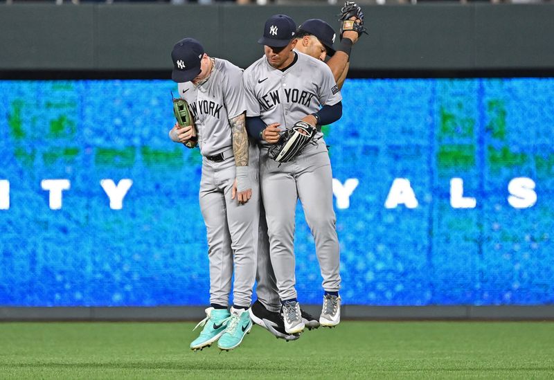 Jun 11, 2024; Kansas City, Missouri, USA; New York Yankees left fielder Alex Verdugo (left) and his teammates celebrate after beating the Kansas City Royals at Kauffman Stadium. Mandatory Credit: Peter Aiken-USA TODAY Sports