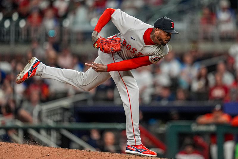 May 30, 2025; Cumberland, Georgia, USA; Boston Red Sox relief pitcher Aroldis Chapman (44) pitches against the Atlanta Braves during the ninth inning at Truist Park. Mandatory Credit: Dale Zanine-Imagn Images