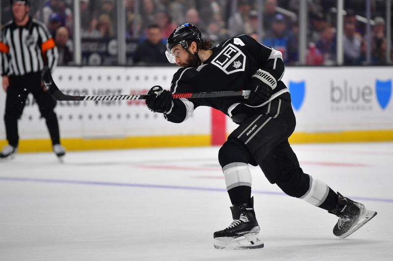 Jan 20, 2024; Los Angeles, California, USA; Los Angeles Kings defenseman Drew Doughty (8) shoots on goal against the New York Rangers durng the second period at Crypto.com Arena. Mandatory Credit: Gary A. Vasquez-USA TODAY Sports