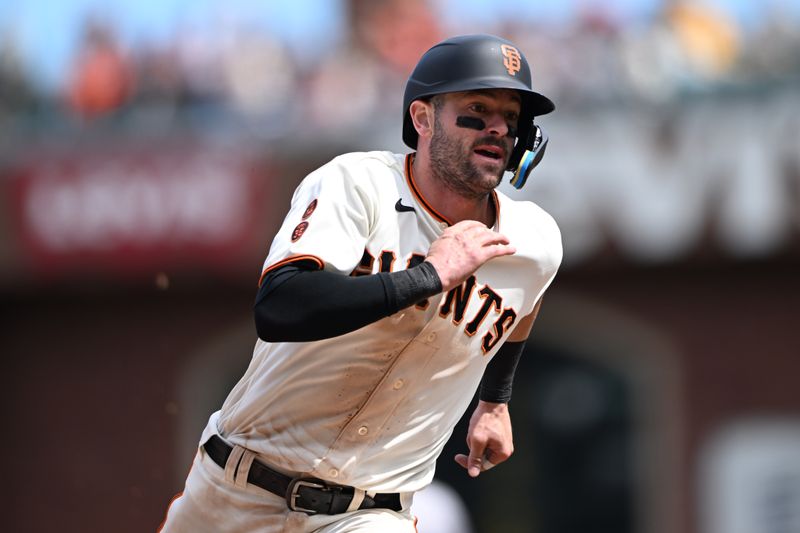 May 21, 2023; San Francisco, California, USA; San Francisco Giants outfielder Mitch Haniger (17) runs toward third base against the Miami Marlins during the eighth inning at Oracle Park. Mandatory Credit: Robert Edwards-USA TODAY Sports