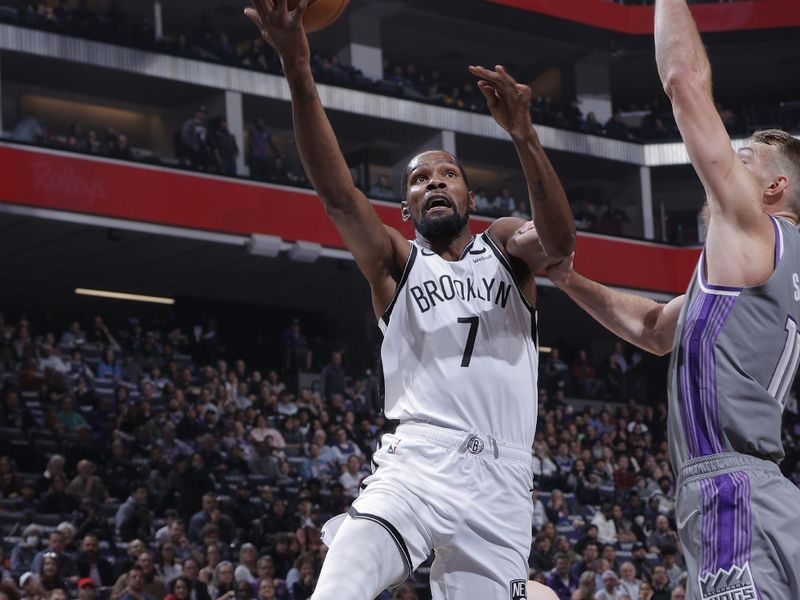 SACRAMENTO, CA - NOVEMBER 15: Kevin Durant #7 of the Brooklyn Nets drives to the basket during the game against the Brooklyn Nets on November 15, 2022 at Golden 1 Center in Sacramento, California. NOTE TO USER: User expressly acknowledges and agrees that, by downloading and or using this Photograph, user is consenting to the terms and conditions of the Getty Images License Agreement. Mandatory Copyright Notice: Copyright 2022 NBAE (Photo by Rocky Widner/NBAE via Getty Images)