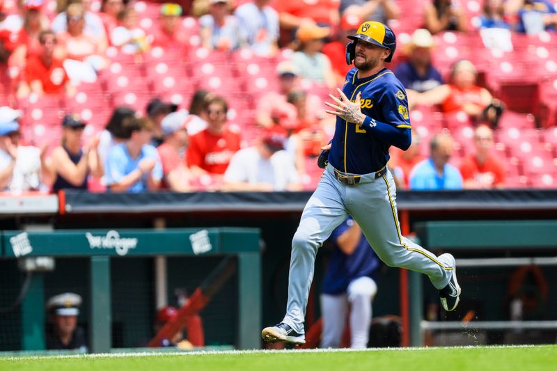 Jun 4, 2025; Cincinnati, Ohio, USA; Milwaukee Brewers second baseman Brice Turang (2) scores on a single hit by third baseman Andruw Monasterio (not pictured) in the third inning against the Cincinnati Reds at Great American Ball Park. Mandatory Credit: Katie Stratman-Imagn Images