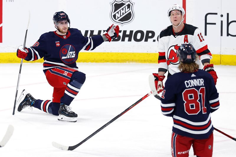 Apr 2, 2023; Winnipeg, Manitoba, CAN; Winnipeg Jets left wing Pierre-Luc Dubois (80) celebrates his third period goal against the New Jersey Devils at Canada Life Centre. Mandatory Credit: James Carey Lauder-USA TODAY Sports