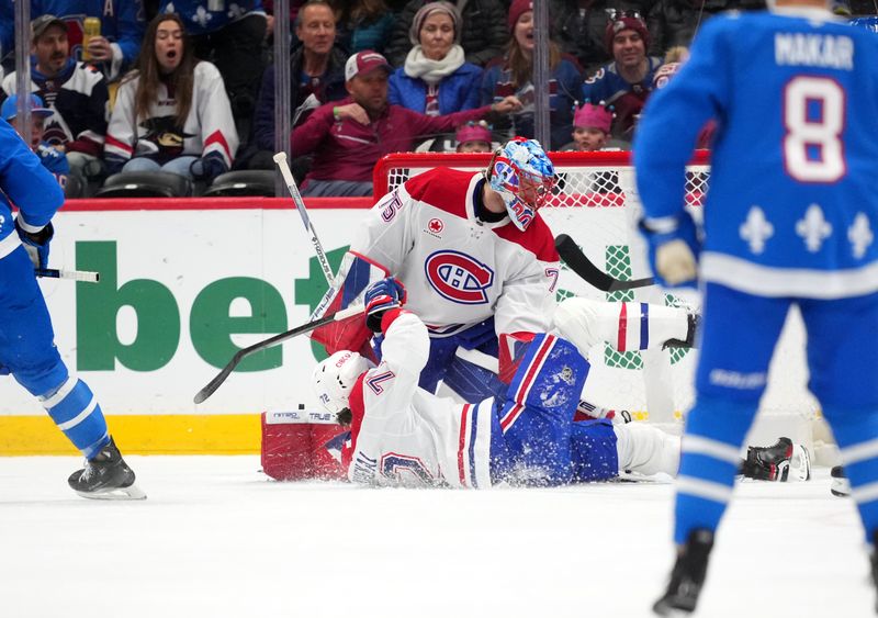 Nov 29, 2025; Denver, Colorado, USA; Montreal Canadiens goaltender Jakub Dobes (75) allows a goal as defenseman Arber Xhekaj (72) falls in the first period against the Colorado Avalanche at Ball Arena. Mandatory Credit: Ron Chenoy-Imagn Images