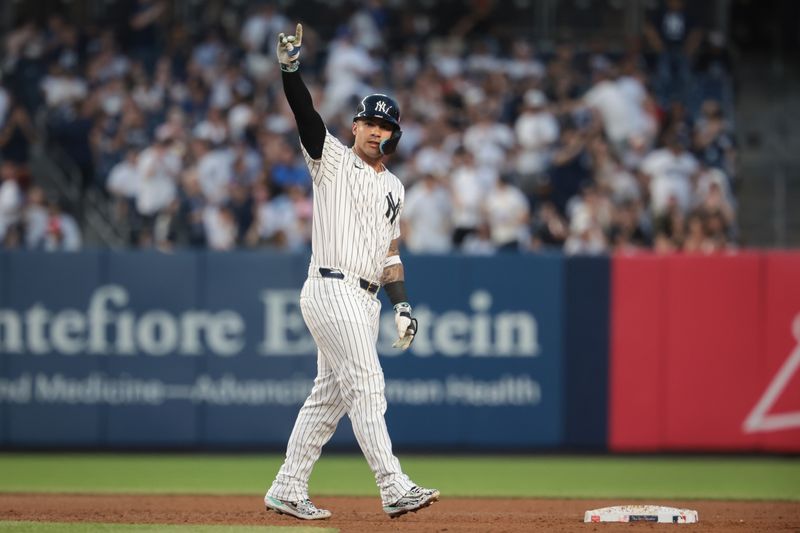 Jun 6, 2024; Bronx, New York, USA; New York Yankees second baseman Gleyber Torres (25) reacts after hitting a two RBI double during the third inning against the Minnesota Twins at Yankee Stadium. Mandatory Credit: Vincent Carchietta-USA TODAY Sports