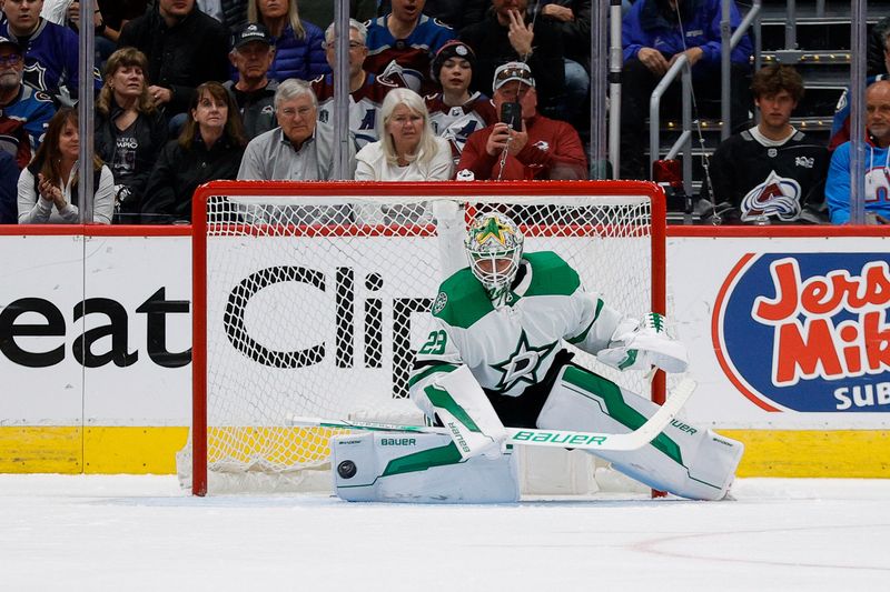 May 13, 2024; Denver, Colorado, USA; Dallas Stars goaltender Jake Oettinger (29) deflects a shot in the third period against the Colorado Avalanche in game four of the second round of the 2024 Stanley Cup Playoffs at Ball Arena. Mandatory Credit: Isaiah J. Downing-USA TODAY Sports