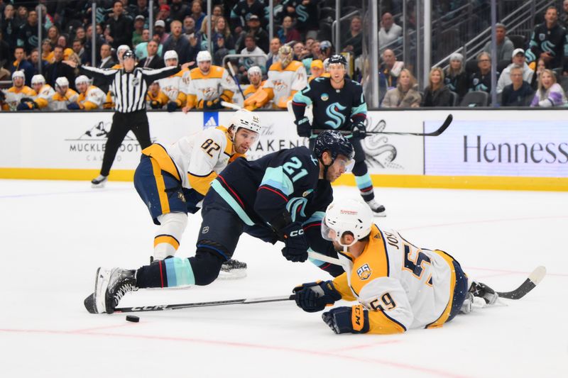 Nov 2, 2023; Seattle, Washington, USA; Nashville Predators defenseman Roman Josi (59) steals the puck from Seattle Kraken center Alex Wennberg (21) during the third period at Climate Pledge Arena. Mandatory Credit: Steven Bisig-USA TODAY Sports