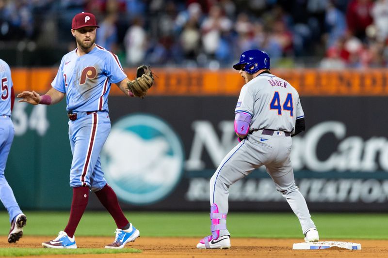 May 16, 2024; Philadelphia, Pennsylvania, USA; New York Mets outfielder Harrison Bader (44) reacts after his RBI single in front of Philadelphia Phillies first base Kody Clemens (2) during the eighth inning at Citizens Bank Park. Mandatory Credit: Bill Streicher-USA TODAY Sports