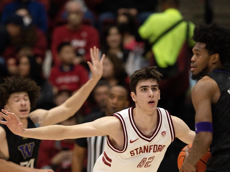 Feb 26, 2023; Stanford, California, USA; Stanford Cardinal forward Maxime Raynaud (42) guards Washington Huskies forward Keion Brooks Jr. (1) during the first half at Maples Pavilion. Mandatory Credit: D. Ross Cameron-USA TODAY Sports