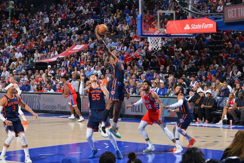 PHILADELPHIA, PA - APRIL 28: OG Anunoby #8 of the New York Knicks rebounds the ball during the game against the Philadelphia 76ers during Round 1 Game 4 of the 2024 NBA Playoffs on April 28, 2024 at the Wells Fargo Center in Philadelphia, Pennsylvania NOTE TO USER: User expressly acknowledges and agrees that, by downloading and/or using this Photograph, user is consenting to the terms and conditions of the Getty Images License Agreement. Mandatory Copyright Notice: Copyright 2024 NBAE (Photo by Jesse D. Garrabrant/NBAE via Getty Images)