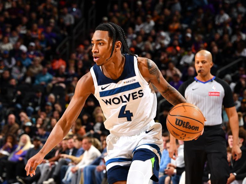 PHOENIX, AZ - JANUARY 29: Rob Dillingham #4 of the Minnesota Timberwolves handles the ball during the game against the Phoenix Suns on January 29, 2025 at Footprint Center in Phoenix, Arizona. NOTE TO USER: User expressly acknowledges and agrees that, by downloading and or using this photograph, user is consenting to the terms and conditions of the Getty Images License Agreement. Mandatory Copyright Notice: Copyright 2025 NBAE (Photo by Barry Gossage/NBAE via Getty Images)