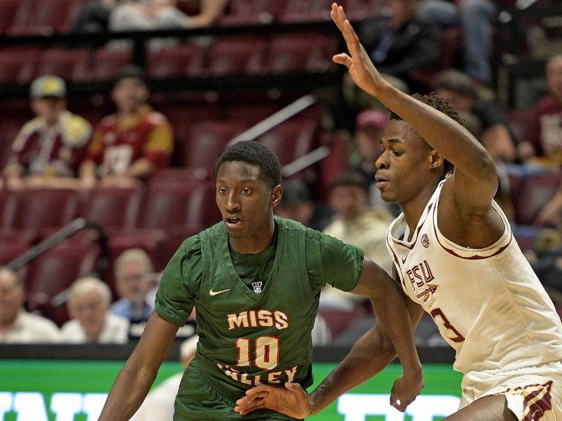 Dec 19, 2025; Tallahassee, Florida, USA; Mississippi Valley State Delta Devils guard Michael James (10) drives to the net past Florida State Seminoles forward Thomas Bassong (3) during the first half at Donald L. Tucker Center. Mandatory Credit: Melina Myers-Imagn Images