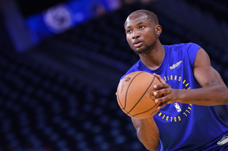 SAN FRANCISCO, CA - OCTOBER 27: Jonathan Kuminga #00 of the Golden State Warriors warms up before the game against the LA Clippers on October 27, 2024 at Chase Center in San Francisco, California. NOTE TO USER: User expressly acknowledges and agrees that, by downloading and or using this photograph, user is consenting to the terms and conditions of Getty Images License Agreement. Mandatory Copyright Notice: Copyright 2024 NBAE (Photo by Noah Graham/NBAE via Getty Images)