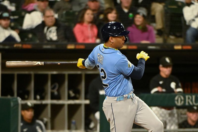 Apr 29, 2023; Chicago, Illinois, USA; Tampa Bay Rays center fielder Jose Siri (22) hits an RBI double against the Chicago White Sox during the seventh inning  at Guaranteed Rate Field. Mandatory Credit: Matt Marton-USA TODAY Sports