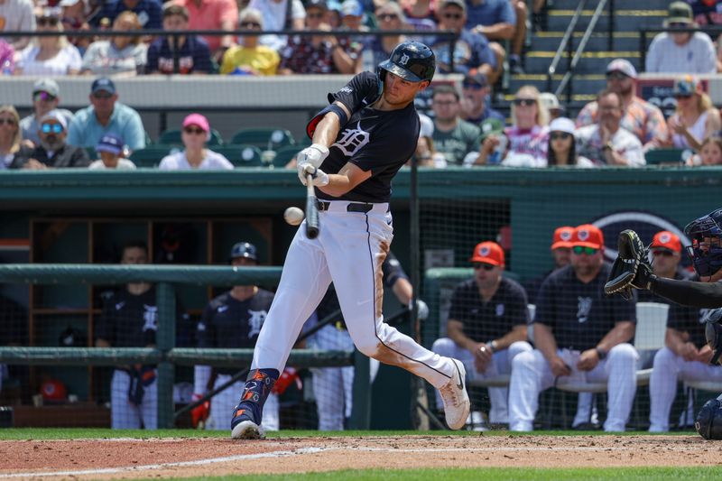 Mar 23, 2024; Lakeland, Florida, USA; Detroit Tigers center fielder Parker Meadows (22) hits a home run during the second inning against the New York Yankees at Publix Field at Joker Marchant Stadium. Mandatory Credit: Mike Watters-USA TODAY Sports