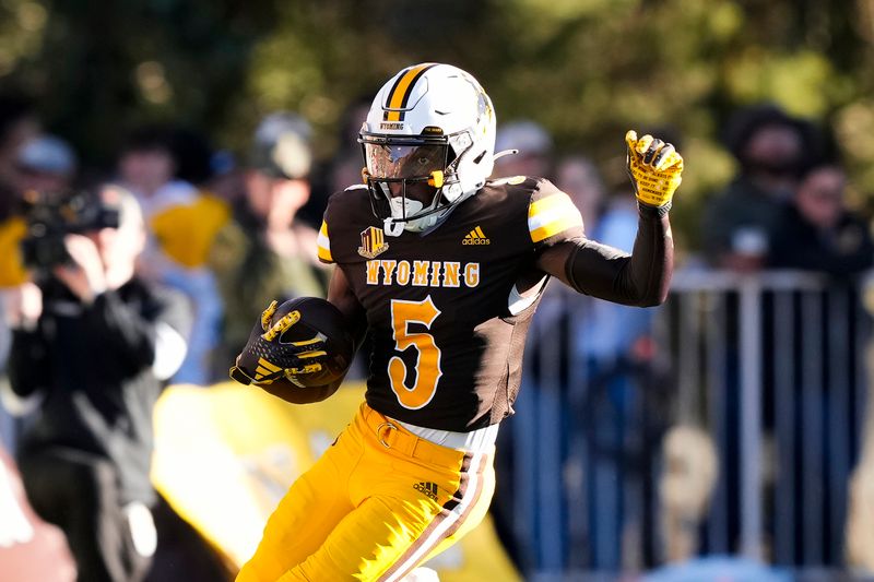 Sep 23, 2023; Laramie, Wyoming, USA; Wyoming Cowboys wide receiver Ayir Asante (5) runs against the Appalachian State Mountaineers during the first quarter at Jonah Field at War Memorial Stadium. Mandatory Credit: Troy Babbitt-USA TODAY Sports