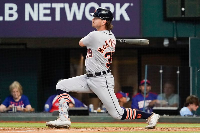 Jun 29, 2023; Arlington, Texas, USA; Detroit Tigers second baseman Zach McKinstry (39) follows thru on an RBI single during the seventh inning against the Texas Rangers at Globe Life Field. Mandatory Credit: Raymond Carlin III-USA TODAY Sports