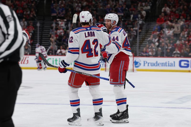 Mar 7, 2026; Newark, New Jersey, USA; New York Rangers defenseman Vladislav Gavrikov (44) celebrates his goal with center Noah Laba (42) against the New Jersey Devils during the first period at Prudential Center. Mandatory Credit: Thomas Salus-Imagn Images