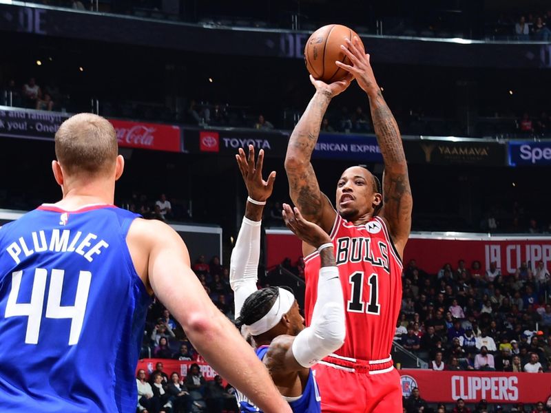 LOS ANGELES, CA - MARCH 27: DeMar DeRozan #11 of the Chicago Bulls shoots the ball during the game against the LA Clippers on March 27, 2023 at Crypto.Com Arena in Los Angeles, California. NOTE TO USER: User expressly acknowledges and agrees that, by downloading and/or using this Photograph, user is consenting to the terms and conditions of the Getty Images License Agreement. Mandatory Copyright Notice: Copyright 2023 NBAE (Photo by Adam Pantozzi/NBAE via Getty Images)