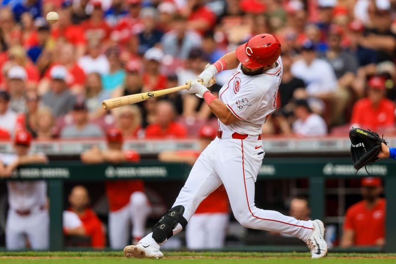 May 26, 2024; Cincinnati, Ohio, USA; Cincinnati Reds designated hitter Nick Martini (23) hits a two-run single in the third inning against the Los Angeles Dodgers at Great American Ball Park. Mandatory Credit: Katie Stratman-USA TODAY Sports