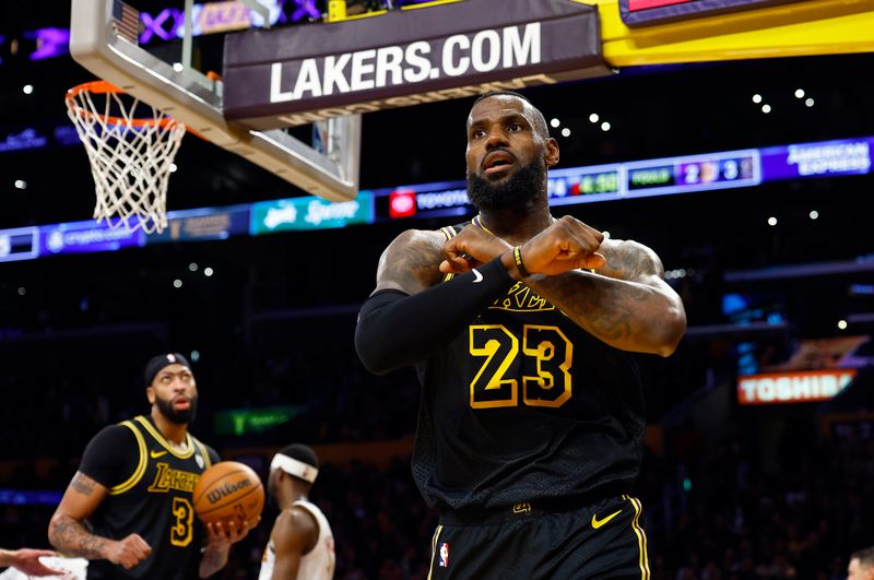 LOS ANGELES, CALIFORNIA - FEBRUARY 08:  LeBron James #23 of the Los Angeles Lakers reacts against the Denver Nuggets in the second half at Crypto.com Arena on February 08, 2024 in Los Angeles, California.  NOTE TO USER: User expressly acknowledges and agrees that, by downloading and/or using this photograph, user is consenting to the terms and conditions of the Getty Images License Agreement.  (Photo by Ronald Martinez/Getty Images)