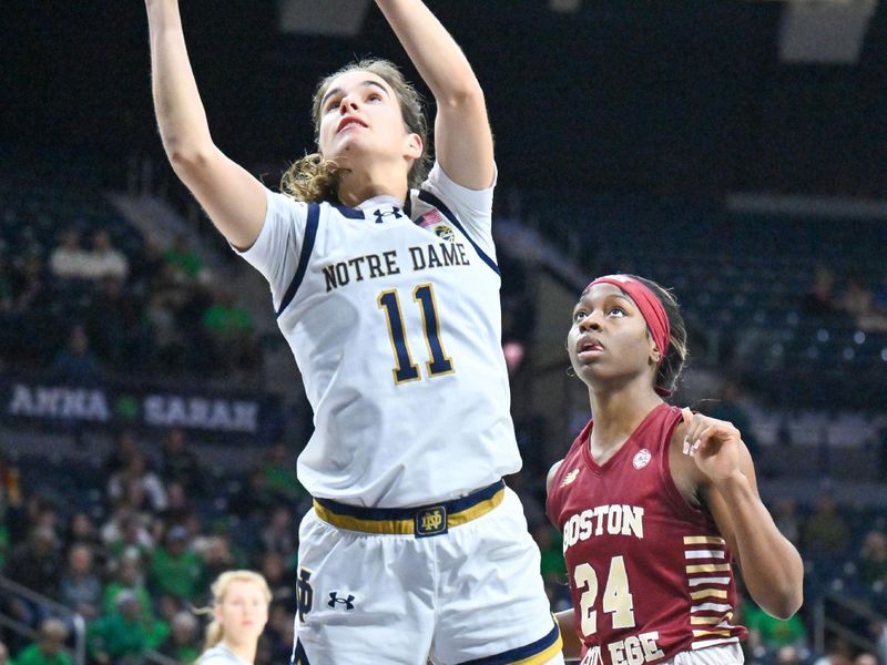 Jan 11, 2024; South Bend, Indiana, USA; Notre Dame Fighting Irish guard Sonia Citron (11) goes up for a shot in front of Boston College Eagles guard Dontavia Waggoner (24) in the second half at the Purcell Pavilion. Mandatory Credit: Matt Cashore-USA TODAY Sports