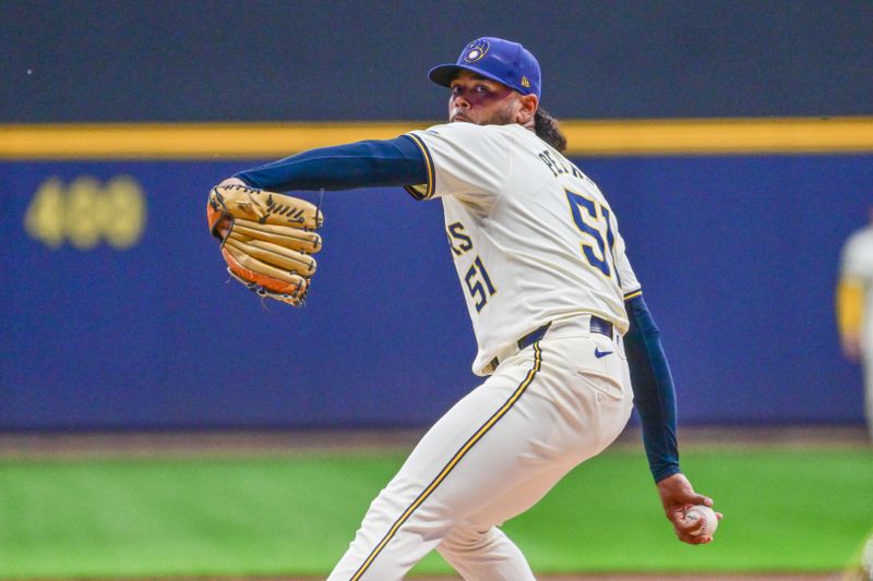 Sep 18, 2024; Milwaukee, Wisconsin, USA;  Milwaukee Brewers starting pitcher Freddy Peralta (51) pitches in the first inning against the Philadelphia Phillies at American Family Field. Mandatory Credit: Benny Sieu-Imagn Images