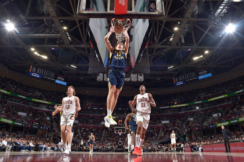 CLEVELAND, OH - APRIL 13: Johnny Furphy #12 of the Indiana Pacers dunks the ball during the game against the Cleveland Cavaliers  on April 13, 2025 at Rocket Arena in Cleveland, Ohio. NOTE TO USER: User expressly acknowledges and agrees that, by downloading and/or using this Photograph, user is consenting to the terms and conditions of the Getty Images License Agreement. Mandatory Copyright Notice: Copyright 2025 NBAE (Photo by David Liam Kyle/NBAE via Getty Images)