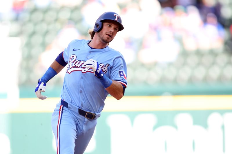 Sep 8, 2024; Arlington, Texas, USA; Texas Rangers center fielder Travis Jankowski (16) runs to third base in the eighth inning against the Los Angeles Angels  at Globe Life Field. Mandatory Credit: Tim Heitman-Imagn Images