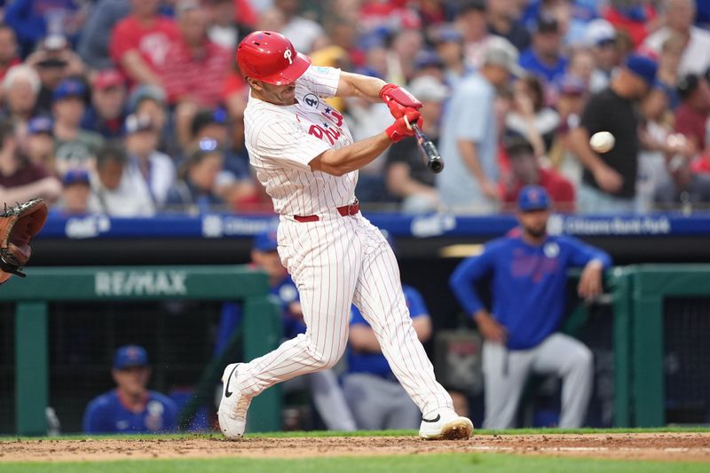 Jun 9, 2025; Philadelphia, Pennsylvania, USA; Philadelphia Phillies infielder Otto Kemp (4) hits a single agianst the Chicago Cubs in the fifth inning at Citizens Bank Park. Mandatory Credit: Kyle Ross-Imagn Images
