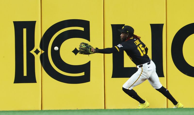 Sep 16, 2025; Pittsburgh, Pennsylvania, USA; Pittsburgh Pirates center fielder Oneil Cruz (15) chases a ball hit for a double by Chicago Cubs first baseman Michael Busch (not pictured) during the sixth inning at PNC Park. Mandatory Credit: Charles LeClaire-Imagn Images