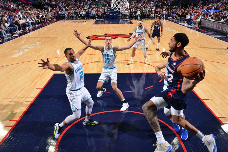 PHILADELPHIA, PA - MARCH 16: Cameron Payne #22 of the Philadelphia 76ers passes the ball during the game against the Charlotte Hornets on March 16, 2024 at the Wells Fargo Center in Philadelphia, Pennsylvania NOTE TO USER: User expressly acknowledges and agrees that, by downloading and/or using this Photograph, user is consenting to the terms and conditions of the Getty Images License Agreement. Mandatory Copyright Notice: Copyright 2024 NBAE (Photo by Jesse D. Garrabrant/NBAE via Getty Images)