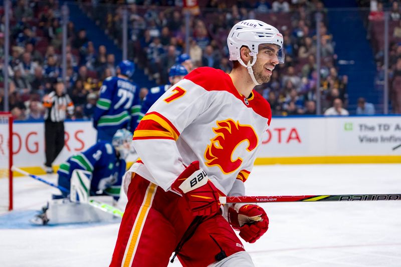 Oct 9, 2024; Vancouver, British Columbia, CAN; Calgary Flames defenseman Kevin Bahl (7) smiles during a stop in play against the Vancouver Canucks during the third period at Rogers Arena. Mandatory Credit: Bob Frid-Imagn Images