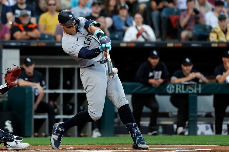 Aug 12, 2024; Chicago, Illinois, USA; New York Yankees outfielder Aaron Judge (99) hits a RBI double against the Chicago White Sox during the first inning at Guaranteed Rate Field. Mandatory Credit: Kamil Krzaczynski-USA TODAY Sports